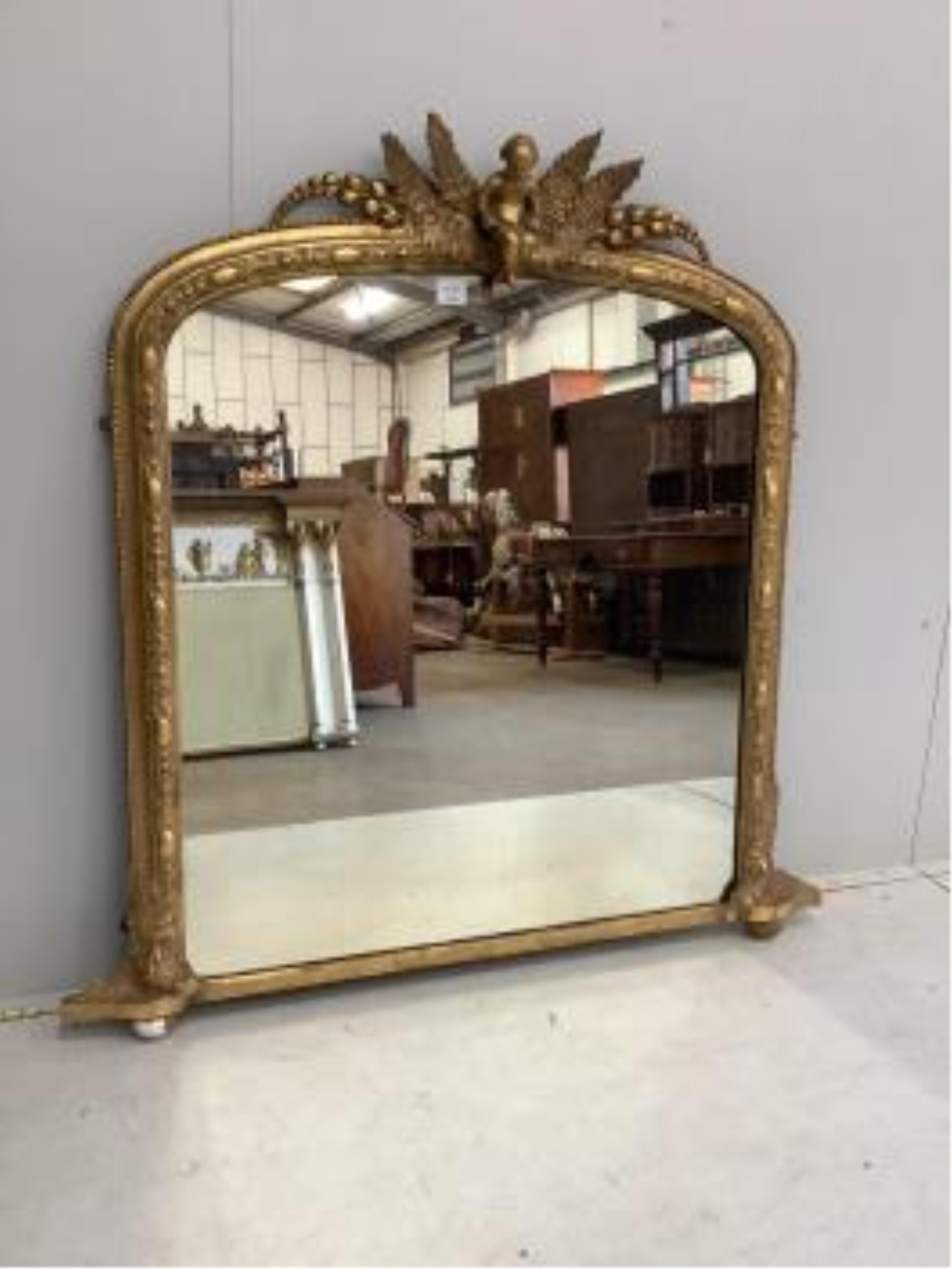 A Victorian giltwood and composition overmantel mirror, width 116cm, height 119cm